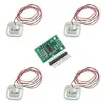 Miniature electronic buzzer kit with circuit board and wires for DIY projects Electronic buzzer kit with circuit board, wires, and components for DIY electronics projects.
